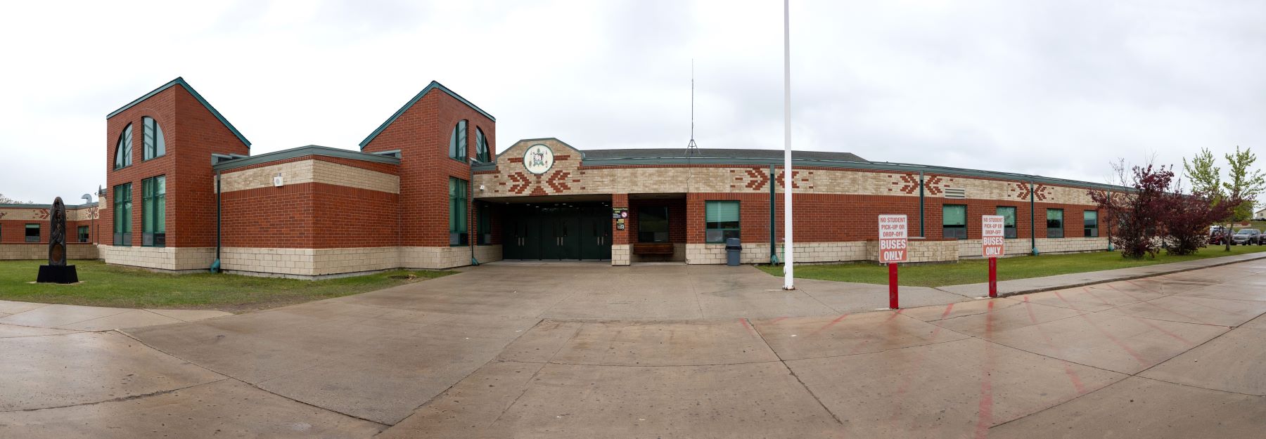 Dunseith Day School buses only signs out front.
