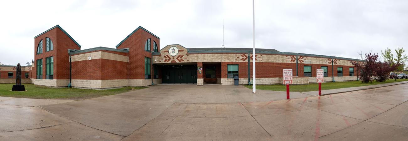 Dunseith Day School buses only signs out front.